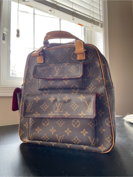 Louis Vuitton Handbags - Authentic Louis Vuitton Monogram Backpack with Tan Leather Trim - Excentri Cite